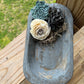 SMALL WEATHERED GREY WOODEN DOUGH BOWL EMBELLISHED WITH MOSS AND WOODEN FLOWERS