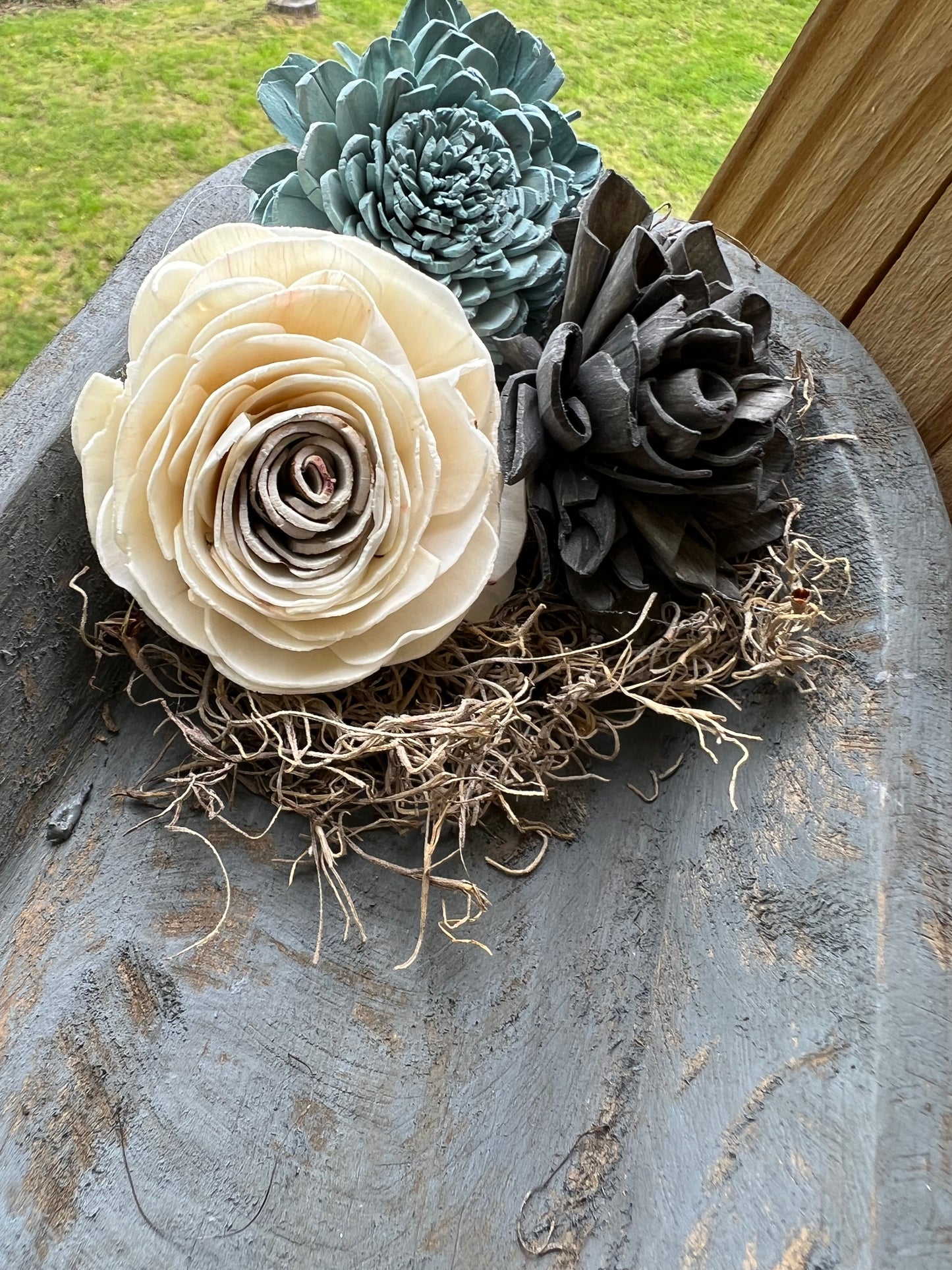 SMALL WEATHERED GREY WOODEN DOUGH BOWL EMBELLISHED WITH MOSS AND WOODEN FLOWERS
