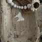 WHITE DISTRESSED WOODEN PRAYER BOWL WITH DISTRESSED BEADED TASSEL