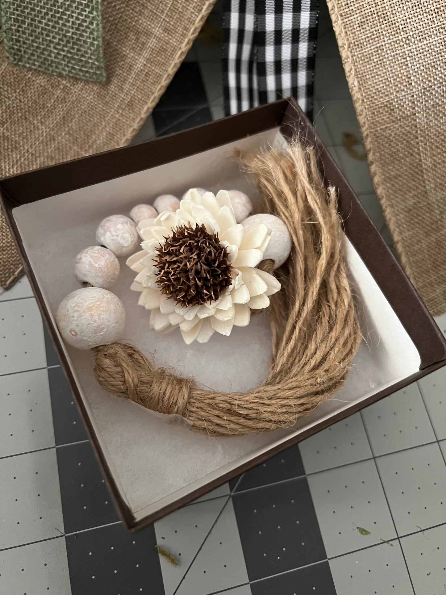 WOODEN BEADED WHITEWASHED TASSEL WITH WOODEN FLOWER EMBELLISHMENT