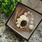 WOODEN BEADED WHITEWASHED TASSEL WITH WOODEN FLOWER EMBELLISHMENT