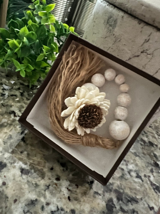 WOODEN BEADED WHITEWASHED TASSEL WITH WOODEN FLOWER EMBELLISHMENT